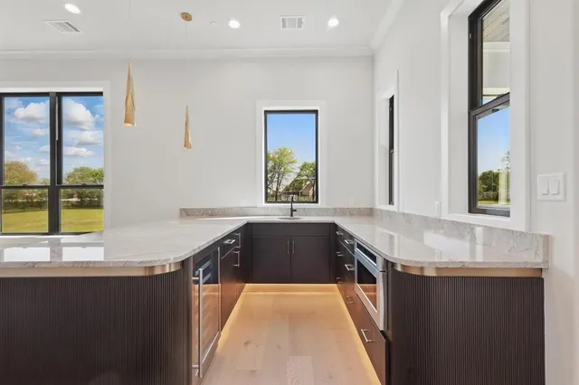 a kitchen with granite countertop a sink and a granite top