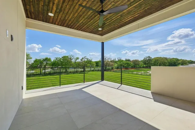 a view of a road with a big yard