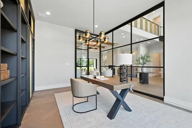 a room with lots of chairs and mirrors