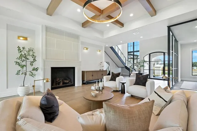 a living room with fireplace furniture and a fireplace