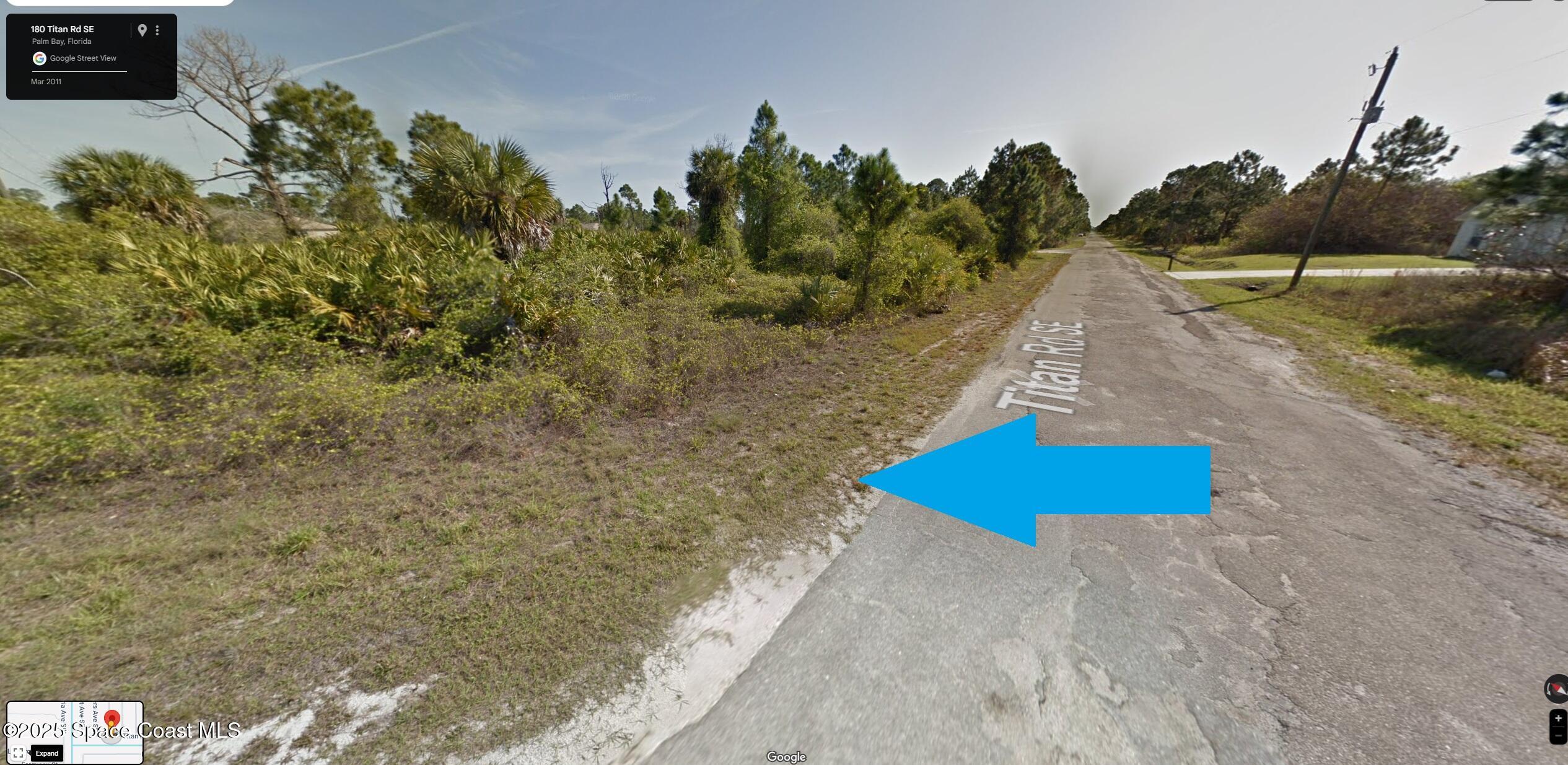 181 Titan Road Southeast Palm Bay, FL 32909 - Photo 1 of 4 a view of a dry yard with trees