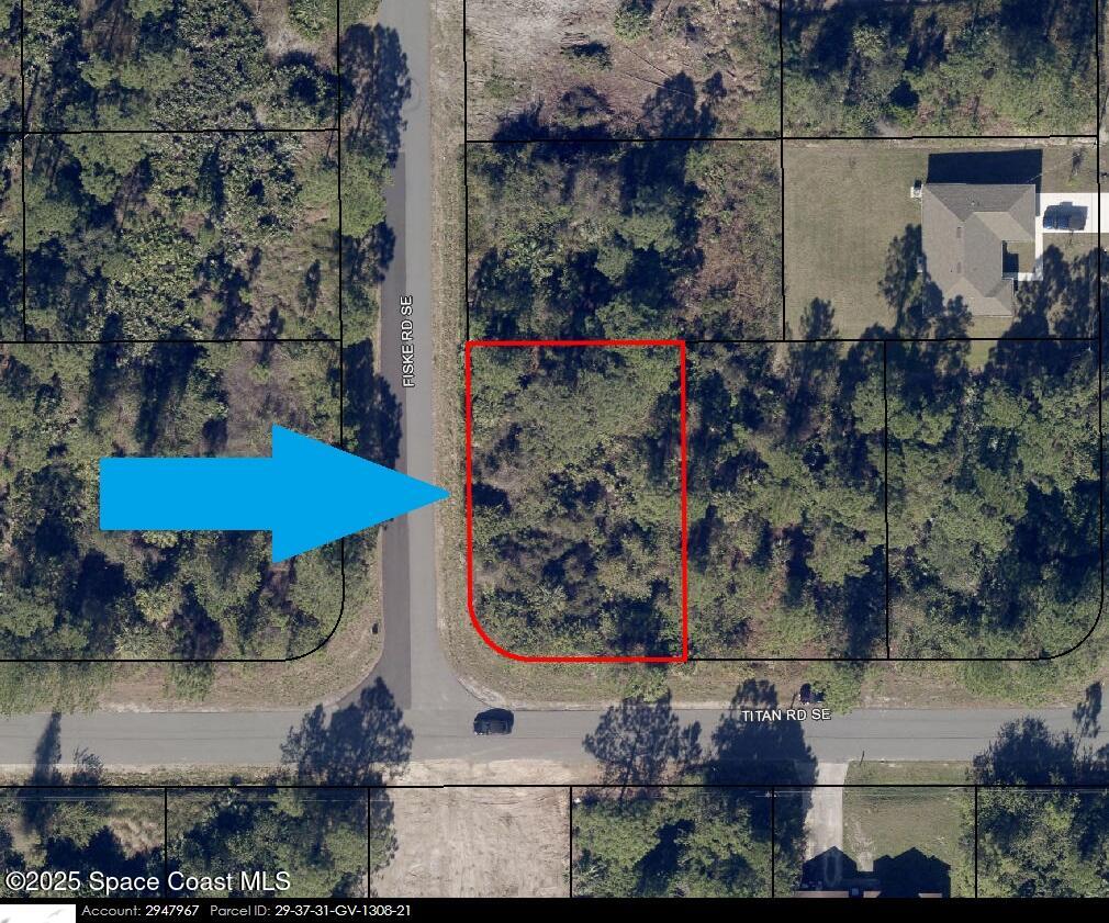 181 Titan Road Southeast Palm Bay, FL 32909 - Photo 2 of 4 an aerial view of a house with a yard