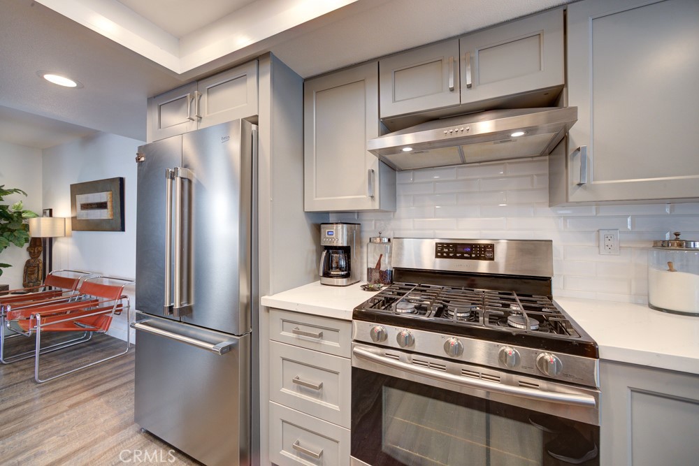 1715 Westfield Road Paso Robles, CA 93446 - Photo 11 of 25 a kitchen with refrigerator and wooden cabinets