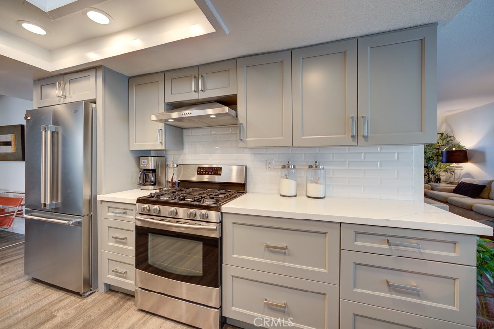 1715 Westfield Road Paso Robles, CA 93446 - Photo 13 of 25 a kitchen with stainless steel appliances white cabinets and a stove top oven