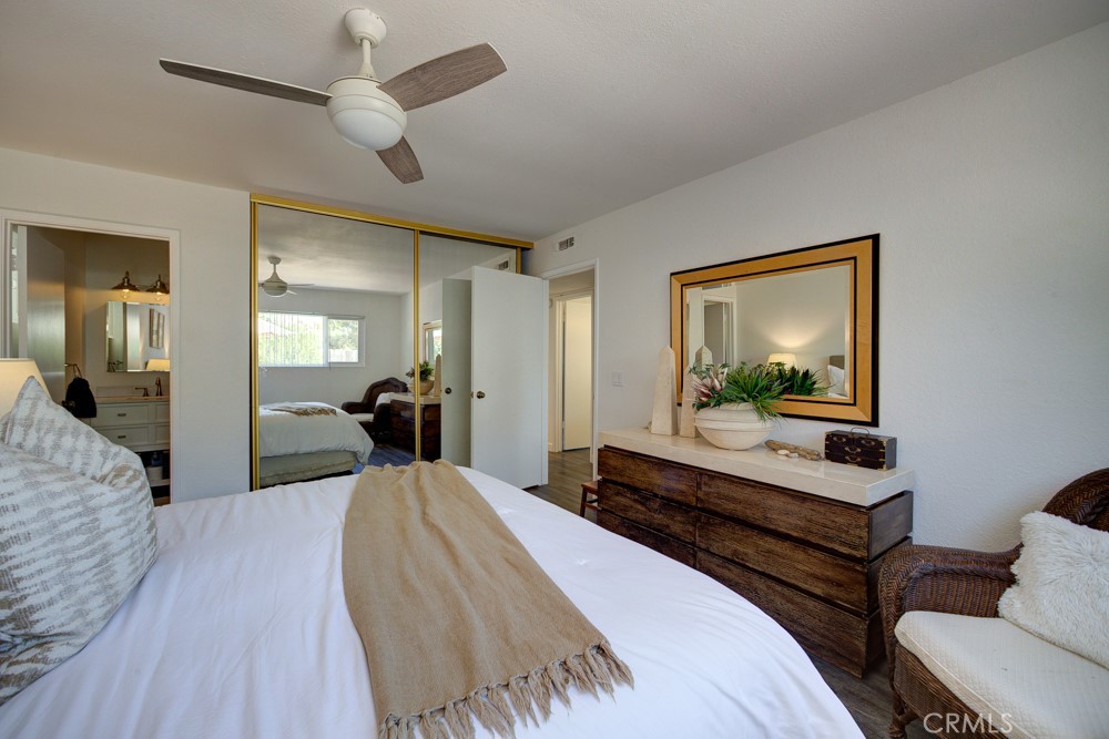 1715 Westfield Road Paso Robles, CA 93446 - Photo 20 of 25 a bedroom with a bed and wooden floor