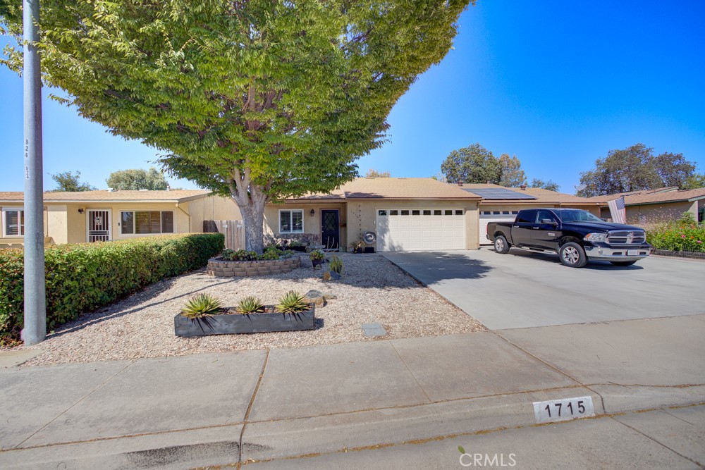 1715 Westfield Road Paso Robles, CA 93446 - Photo 2 of 25 a car parked in front of a white house