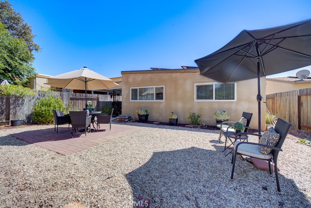 1715 Westfield Road Paso Robles, CA 93446 - Photo 24 of 25 a patio with a table and chairs under an umbrella