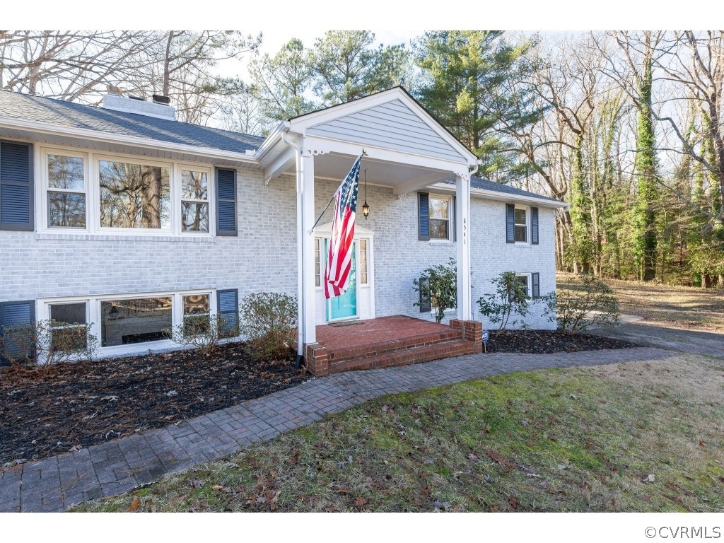 8541 Elm Road Richmond, VA 23235 - Photo 3 of 50 a view of a house with backyard and garden