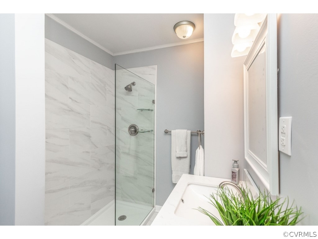 8541 Elm Road Richmond, VA 23235 - Photo 33 of 50 a bathroom with a shower and a sink