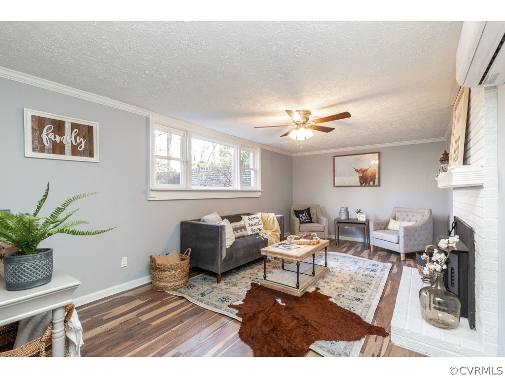 8541 Elm Road Richmond, VA 23235 - Photo 38 of 50 a living room with furniture a chandelier and a window