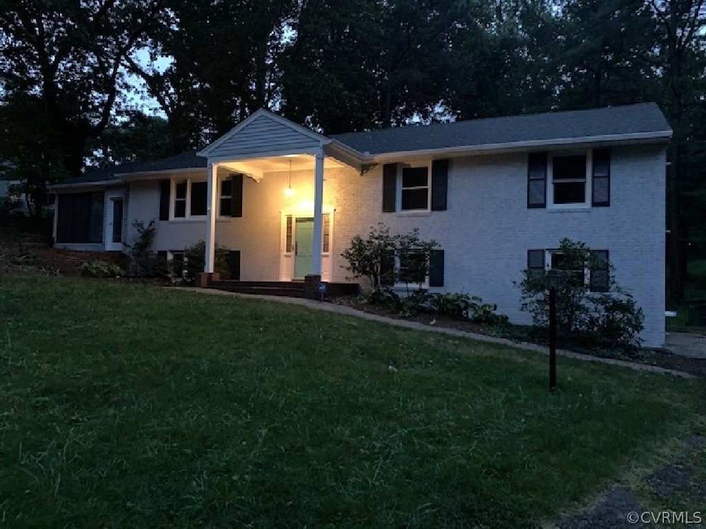 8541 Elm Road Richmond, VA 23235 - Photo 4 of 50 a front view of a house with a garden