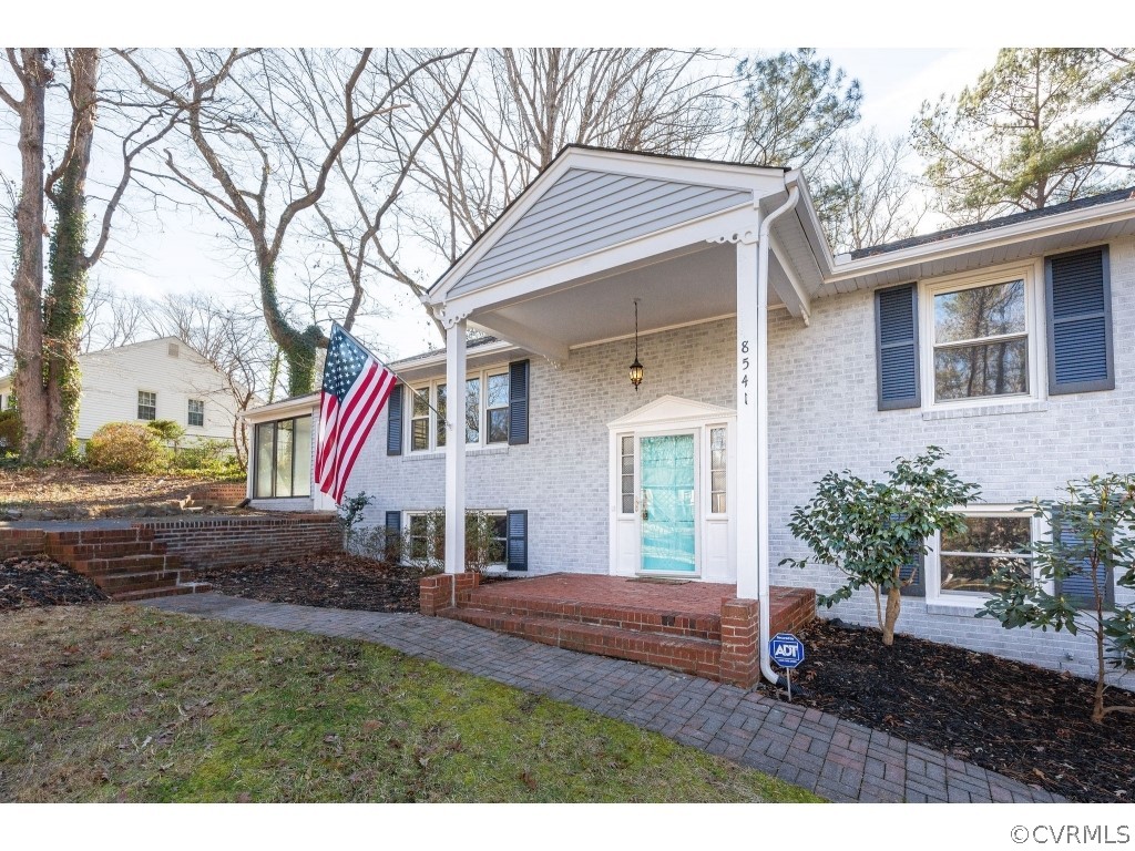 8541 Elm Road Richmond, VA 23235 - Photo 47 of 50 a front view of a house with a yard
