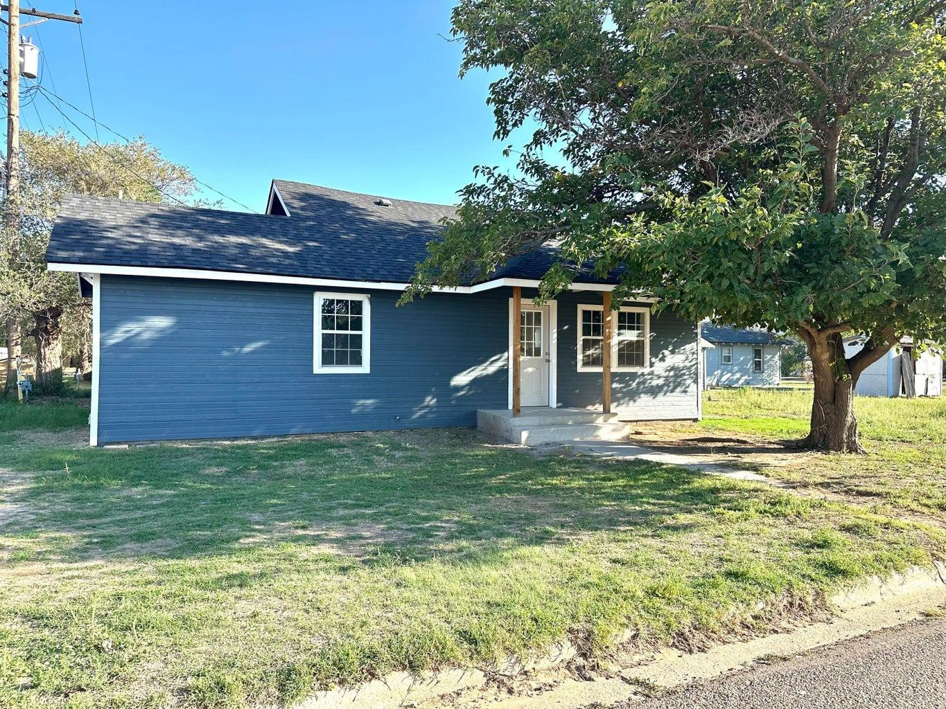 1704 West 6th Plainview, TX 79072 - Photo 1 of 13 a view of a house with pool and a yard