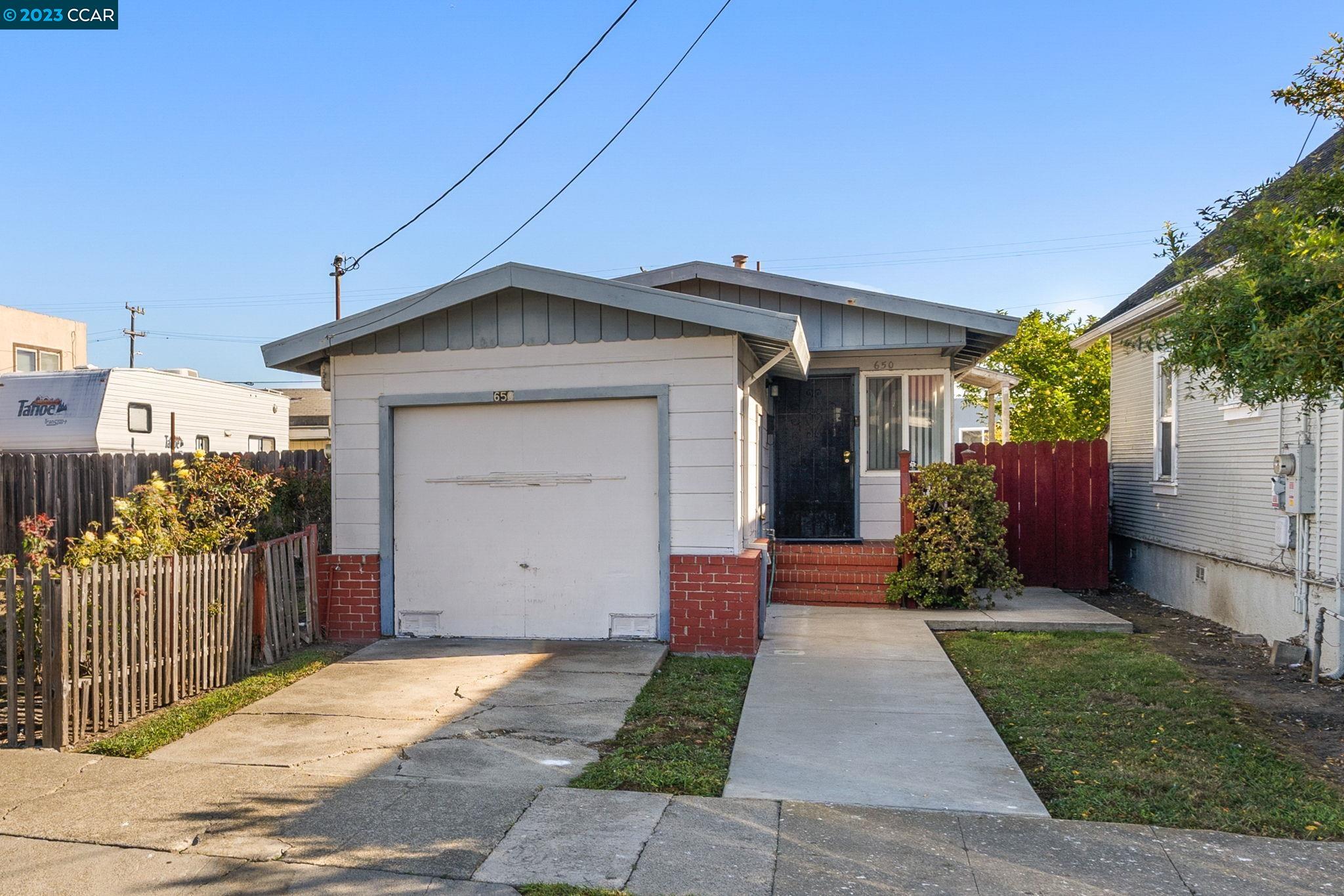 650 9th Street Richmond, CA 94801 - Photo 1 of 1 a front view of a house with a yard