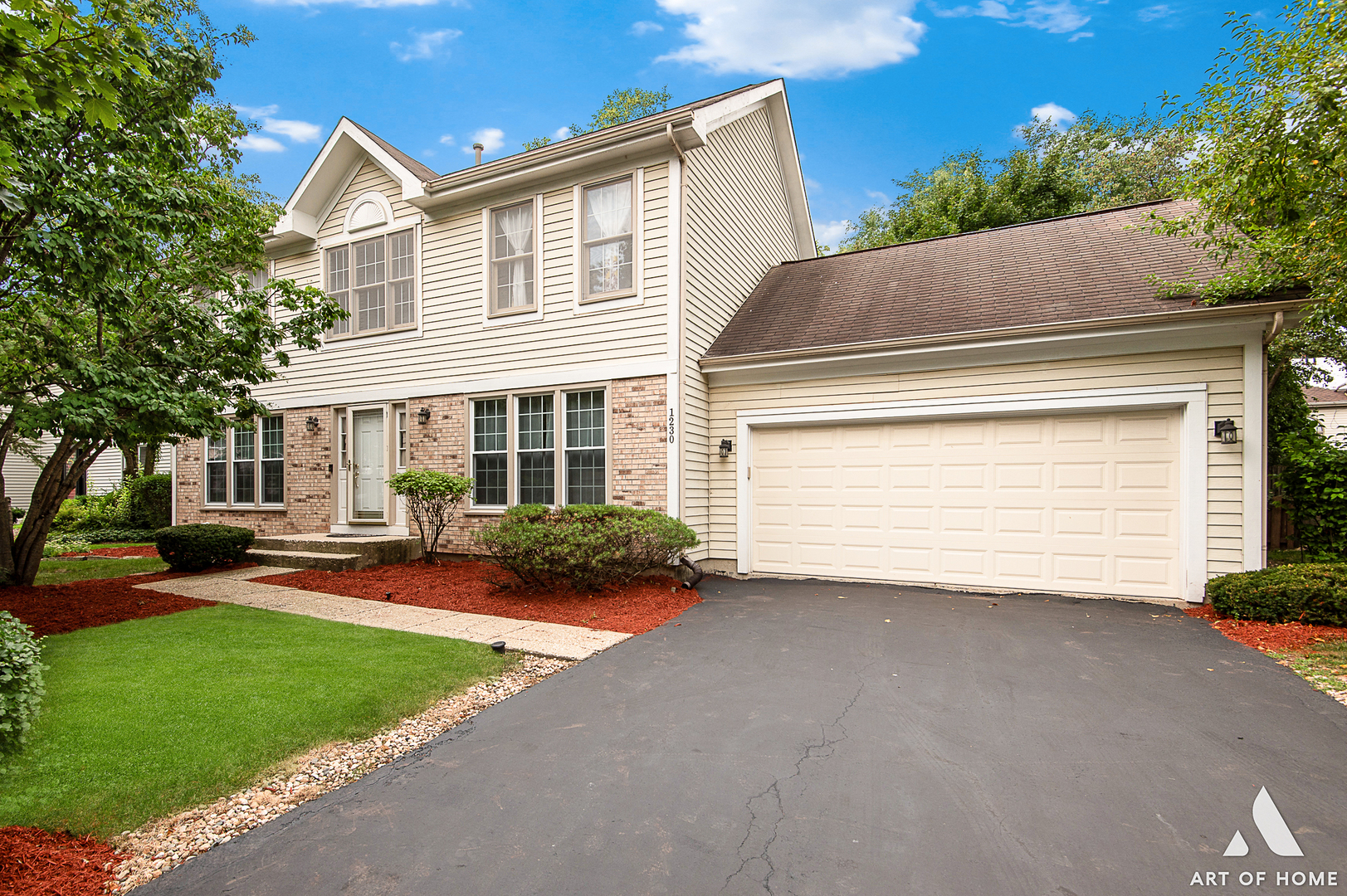 1230 Cobblers Crossing Elgin, IL 60120 - Photo 2 of 4 a front view of a house with a yard and garage