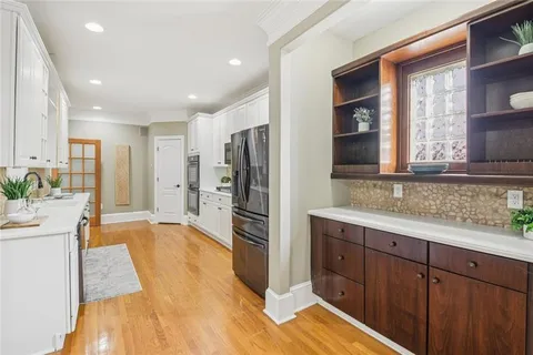 a bathroom with a sink and a large mirror