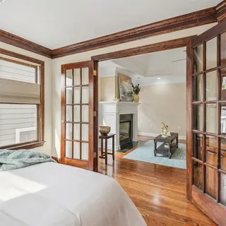a bedroom with furniture and a window