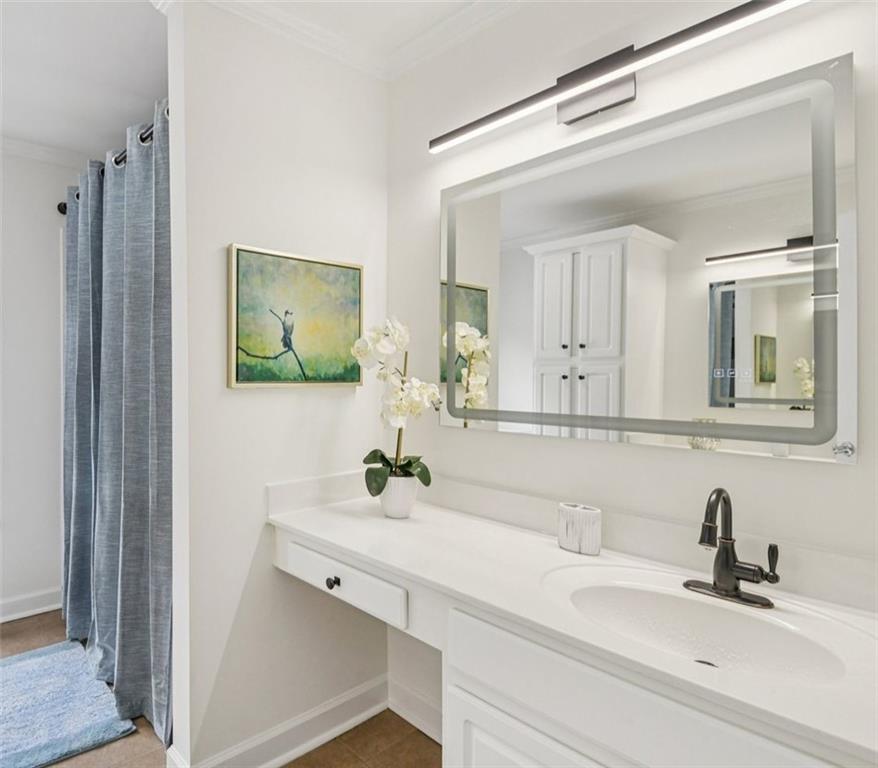 121 Fulton Way Southeast Atlanta, GA 30312 - Photo 28 of 38 a bathroom with a sink and a mirror