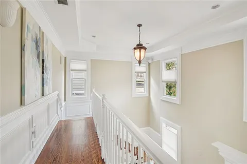 a view of a balcony with wooden floor