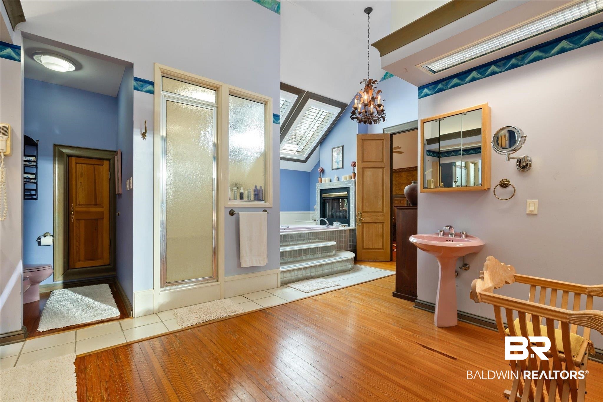 3325 Riviere Du Chien Road Mobile, AL 36693 - Photo 43 of 71 Dining space featuring hardwood / wood-style flooring, high vaulted ceiling, and an inviting chandelier