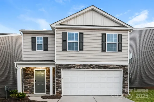 a view of a house with large windows