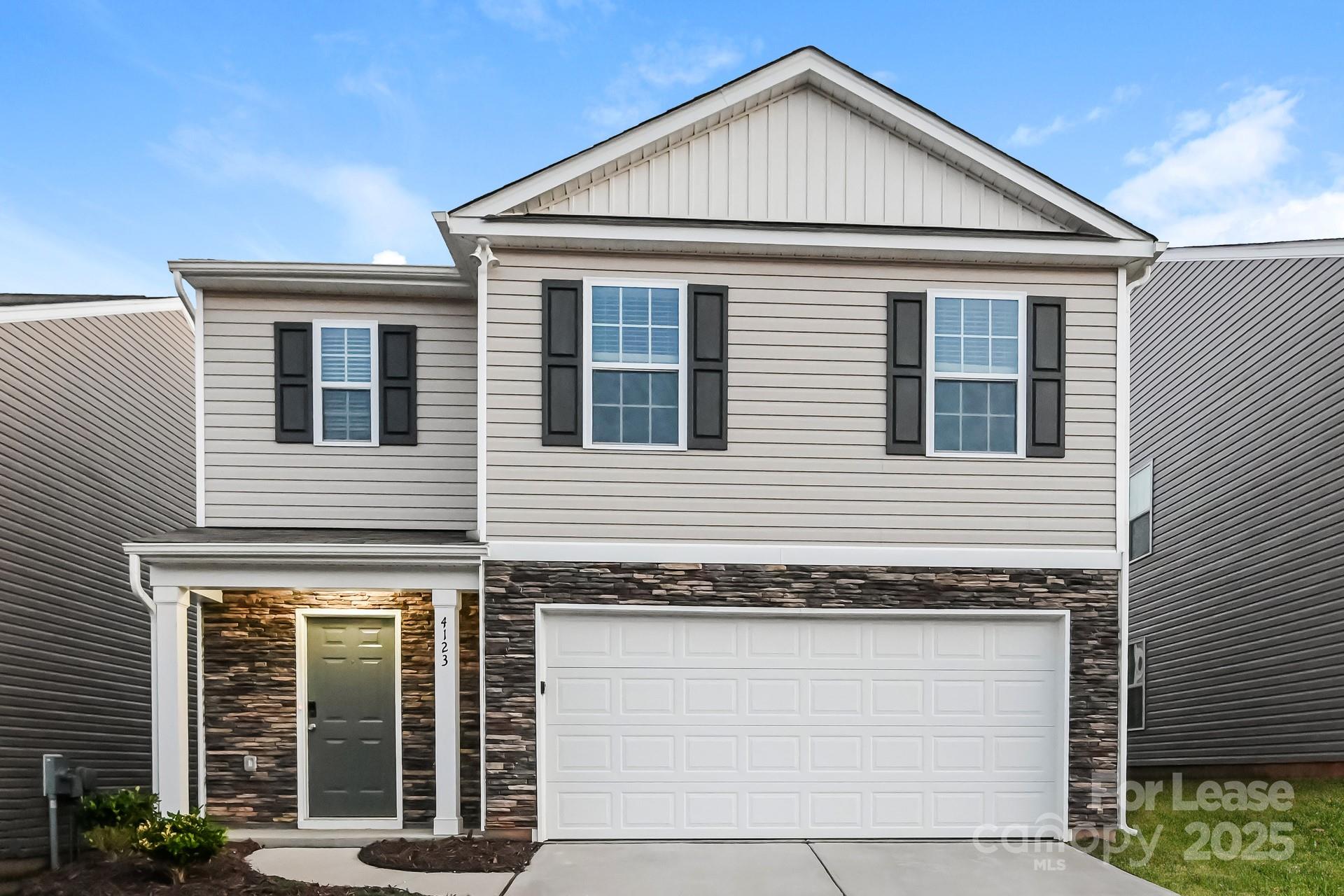 4123 Long Arrow Drive Concord, NC 28025 - Photo 1 of 17 a view of a house with large windows