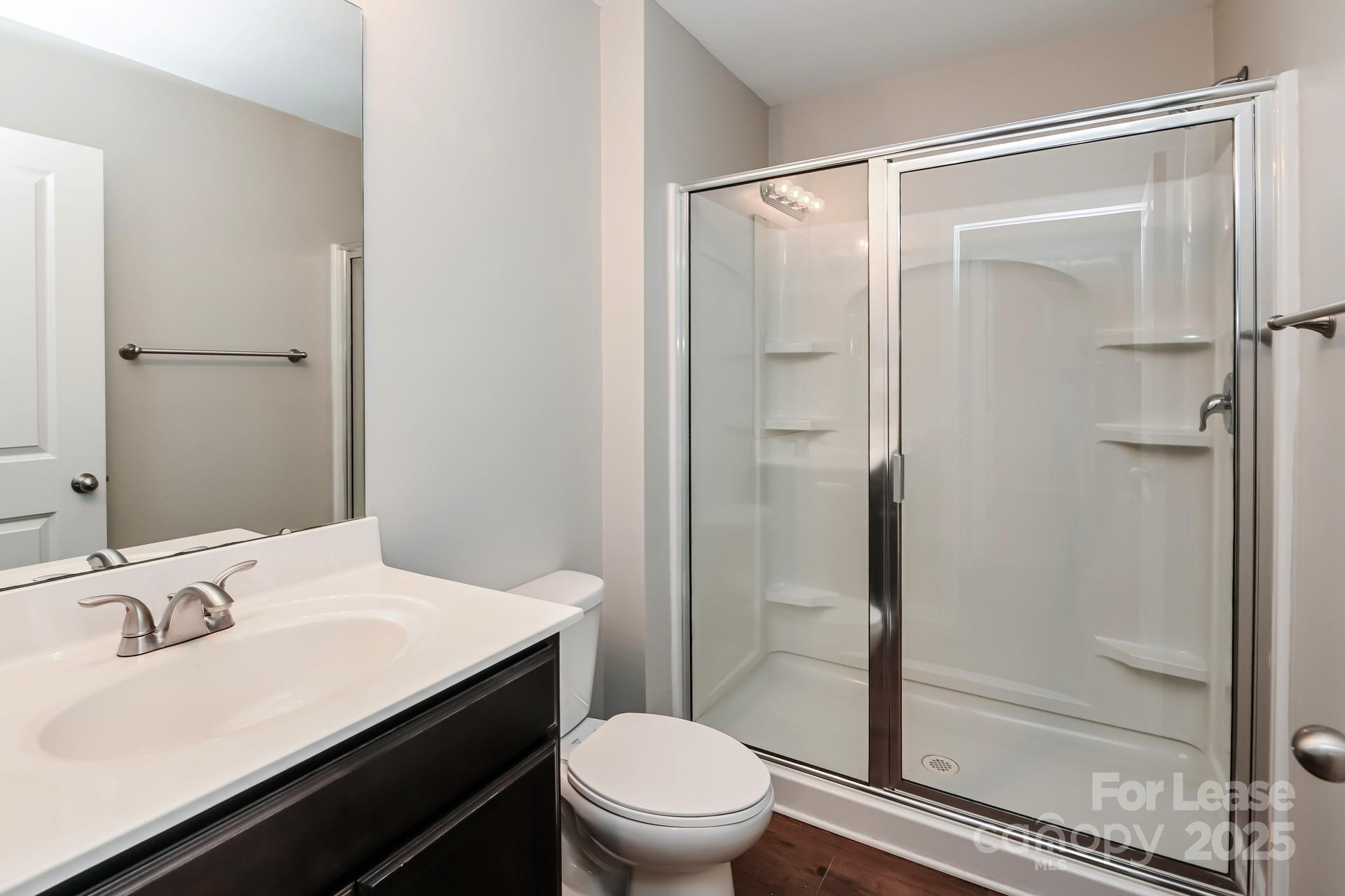 4123 Long Arrow Drive Concord, NC 28025 - Photo 14 of 17 a bathroom with a sink a toilet and shower