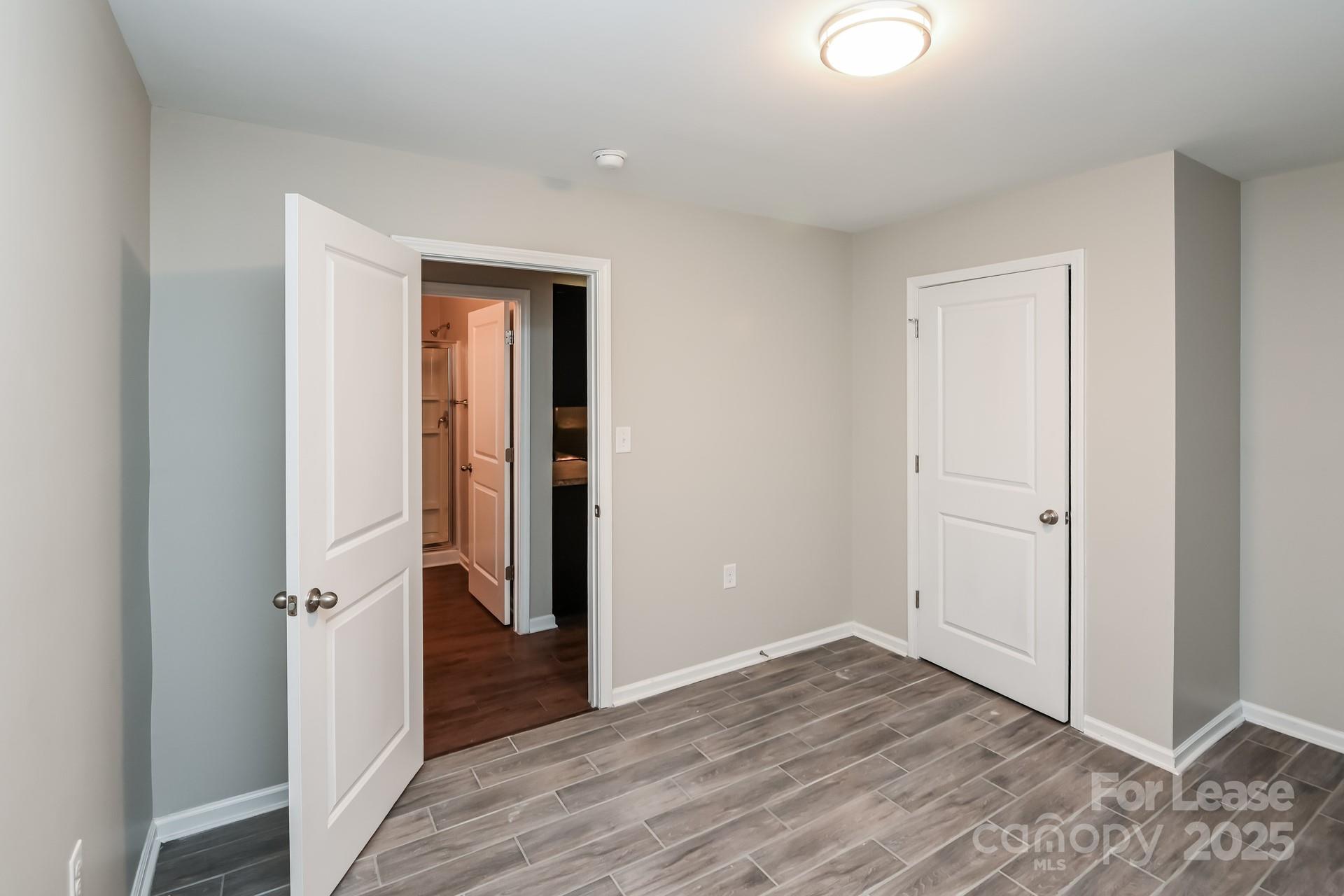 4123 Long Arrow Drive Concord, NC 28025 - Photo 9 of 17 a view of an empty room with wooden floor and closet
