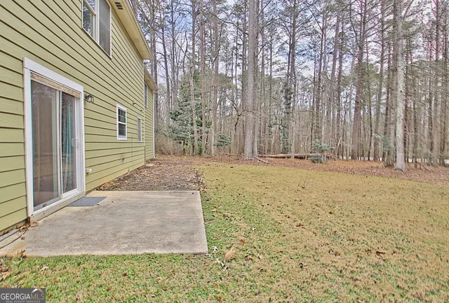 a kitchen with stainless steel appliances granite countertop a refrigerator stove a sink and a microwave