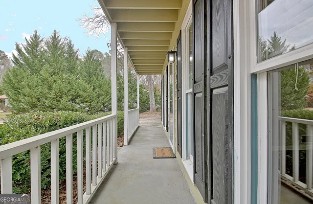 a view of staircase with white walls and windows