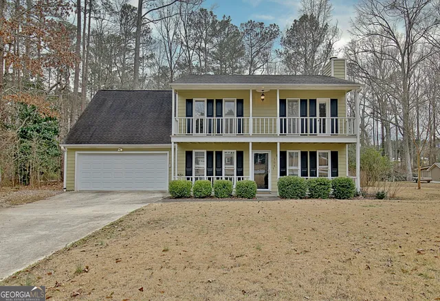 a car parked in parking area next to a building