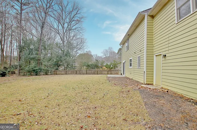 a view of a lake with a yard