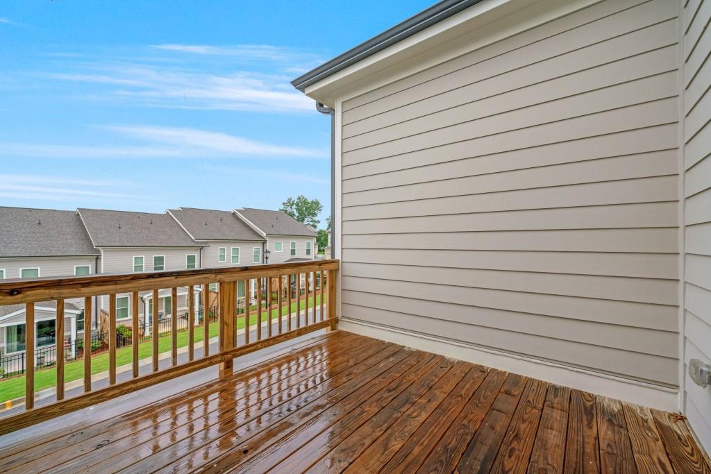 5217 Riden Court, Unit 263 Buford, GA 30518 - Photo 18 of 34 a view of a balcony with wooden floor