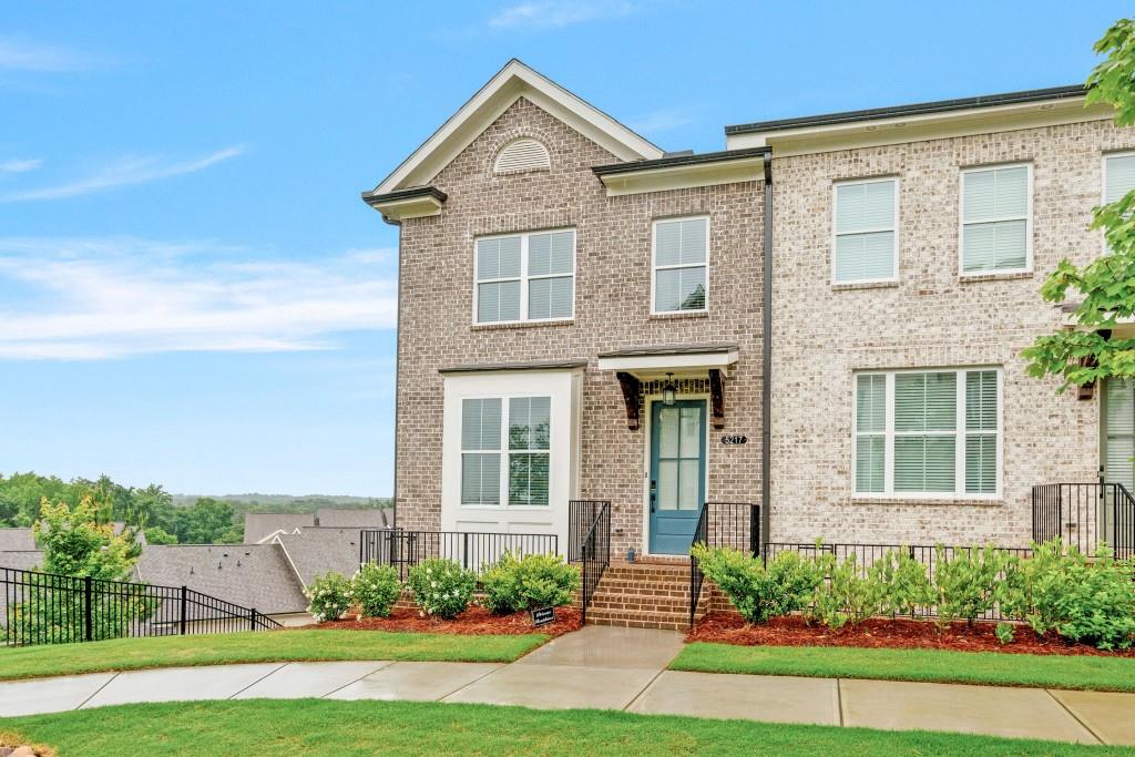 5217 Riden Court, Unit 263 Buford, GA 30518 - Photo 2 of 34 front view of a house with a yard