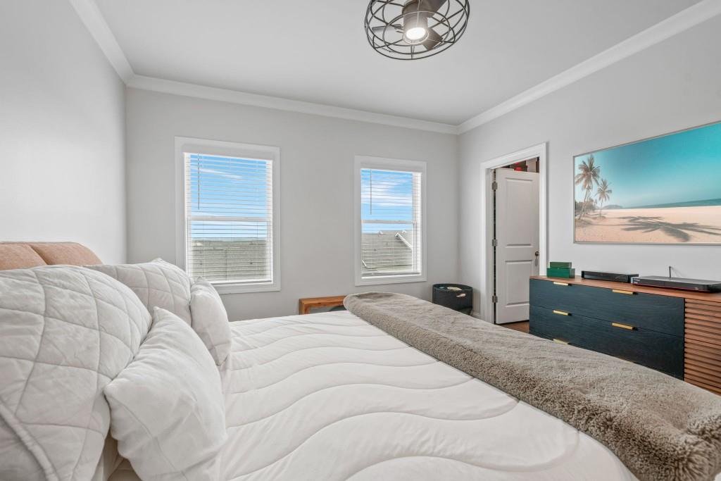 5217 Riden Court, Unit 263 Buford, GA 30518 - Photo 22 of 34 a bedroom with a bed and a large window