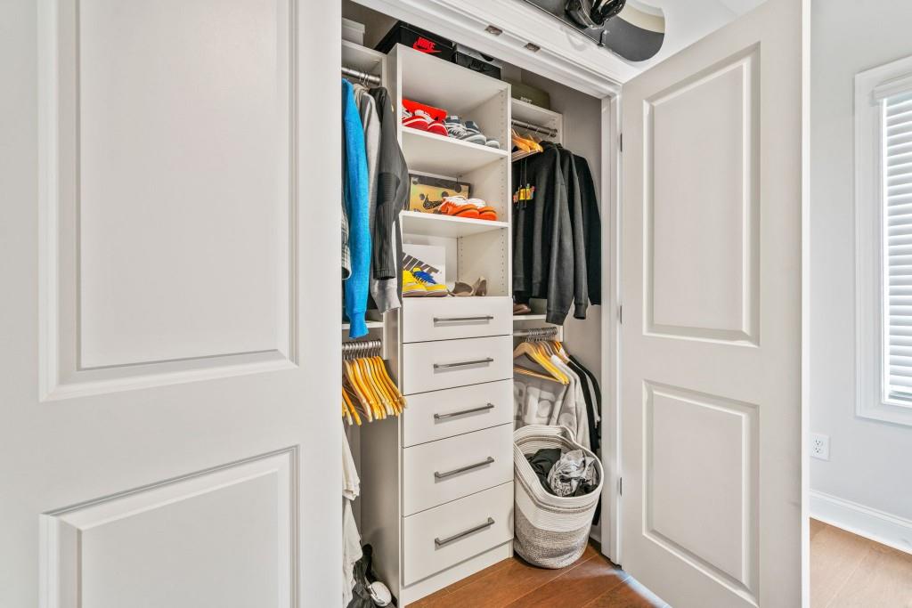5217 Riden Court, Unit 263 Buford, GA 30518 - Photo 26 of 34 a view of walk in closet with clothes