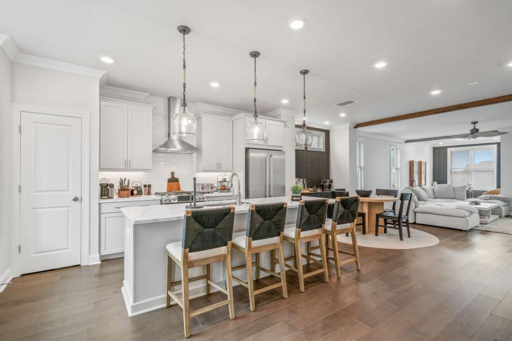 5217 Riden Court, Unit 263 Buford, GA 30518 - Photo 6 of 34 a large kitchen with a table and chairs