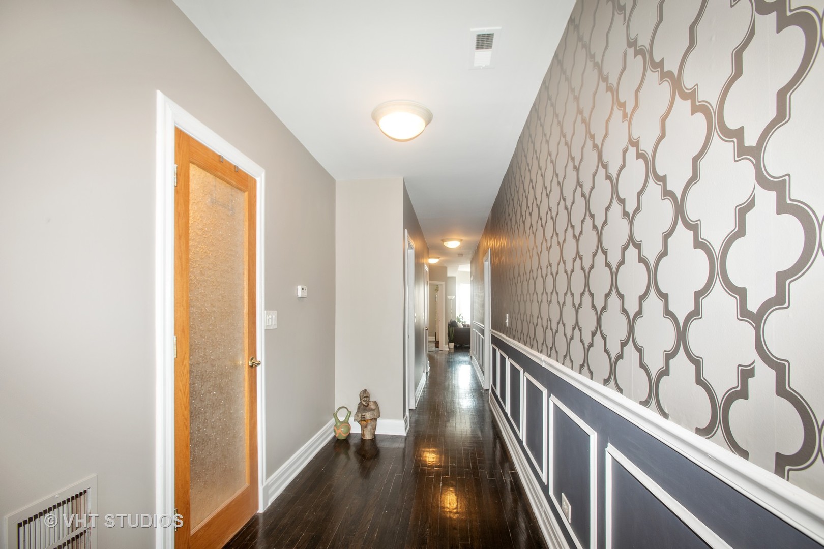 4631 South Indiana Avenue, Unit 3N Chicago, IL 60653 - Photo 6 of 11 a view of hallway with stairs and wooden floor