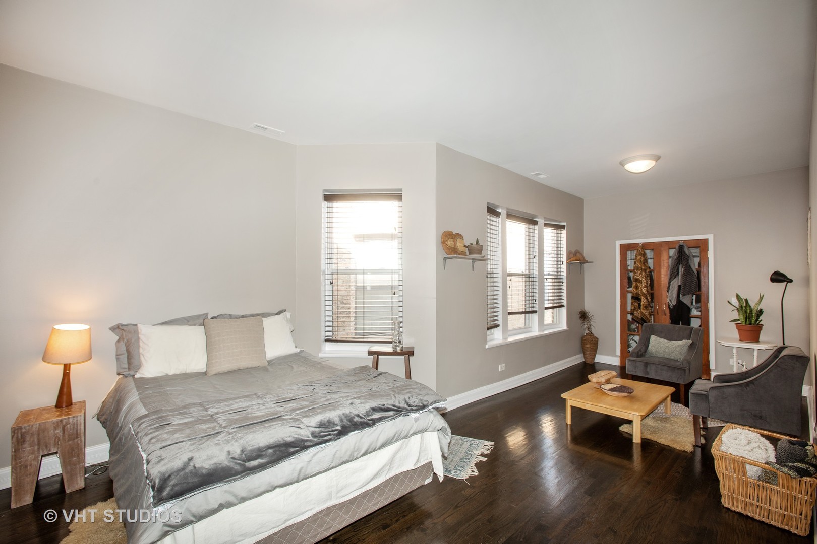 4631 South Indiana Avenue, Unit 3N Chicago, IL 60653 - Photo 7 of 11 a bedroom with a bed and wooden floor