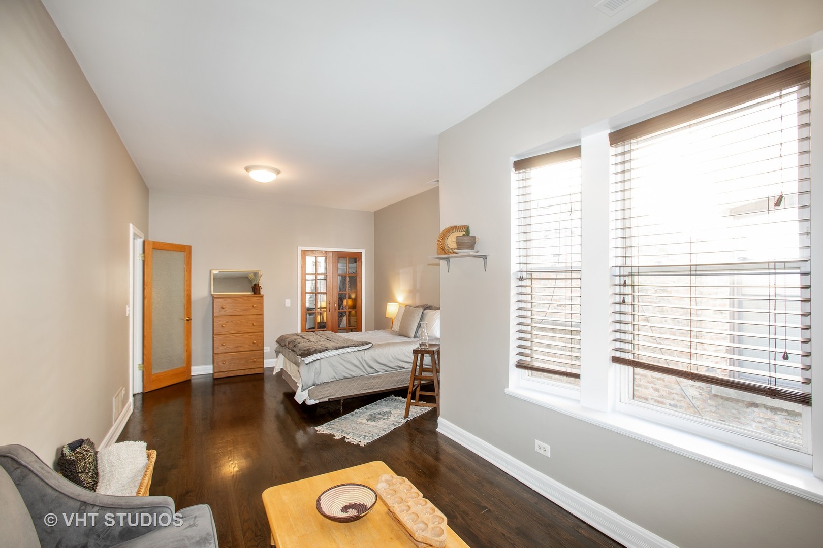 4631 South Indiana Avenue, Unit 3N Chicago, IL 60653 - Photo 8 of 11 a bedroom with furniture and a large window