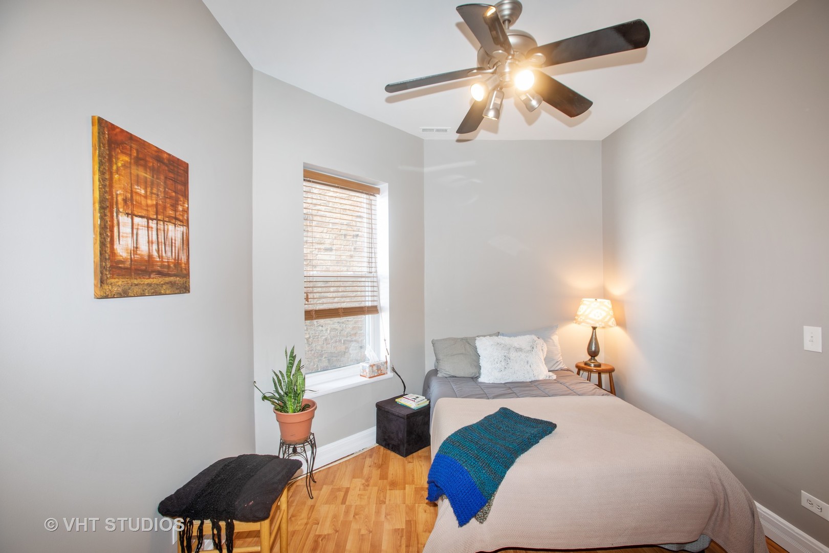 4631 South Indiana Avenue, Unit 3N Chicago, IL 60653 - Photo 9 of 11 a bedroom with a bed and a window
