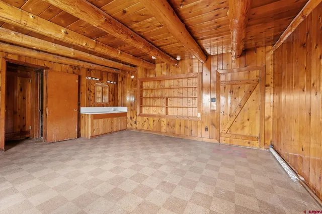 a view of an empty room with a fireplace