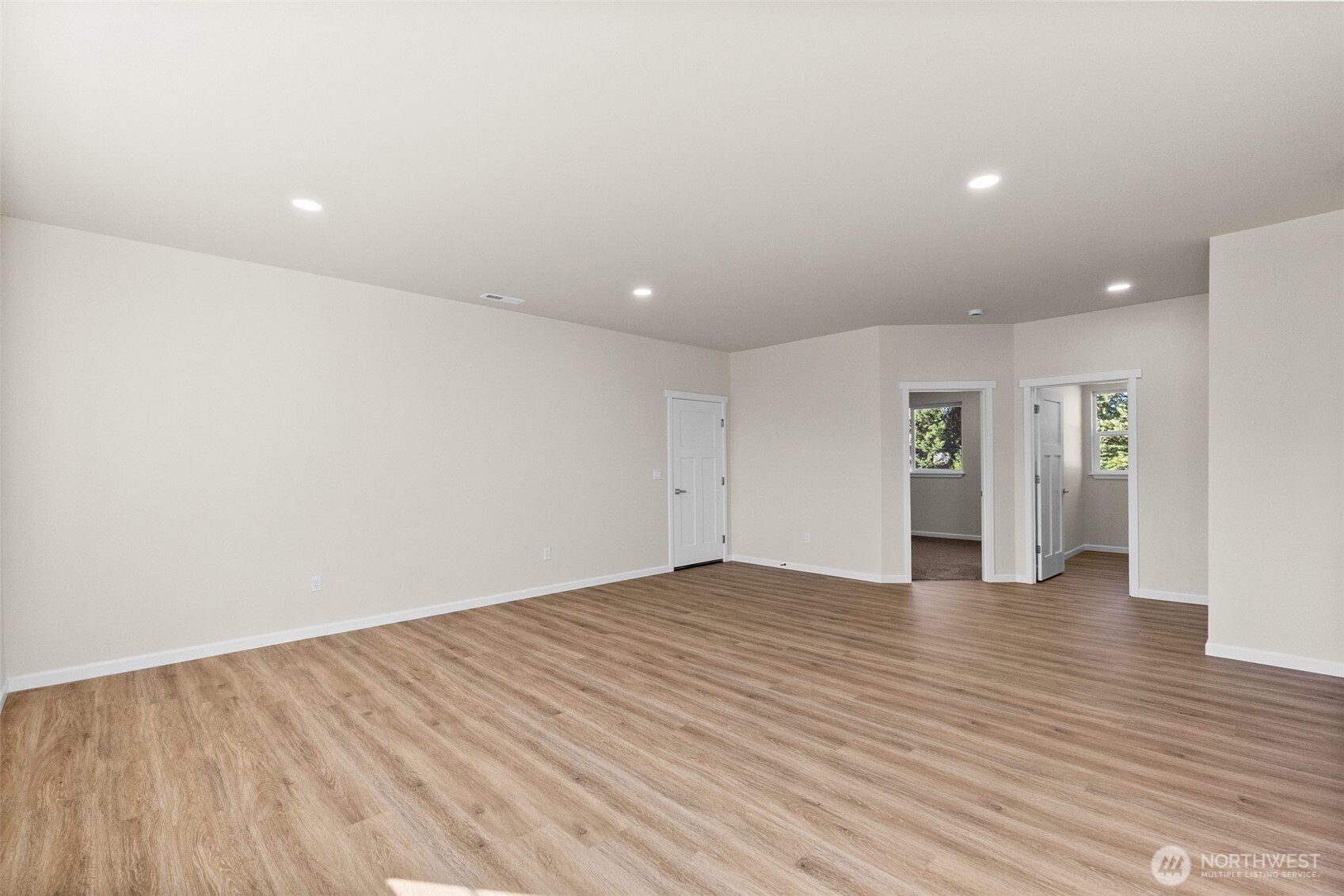 6123 186th Trail Southwest Rochester, WA 98579 - Photo 14 of 35 a view of an empty room with wooden floor