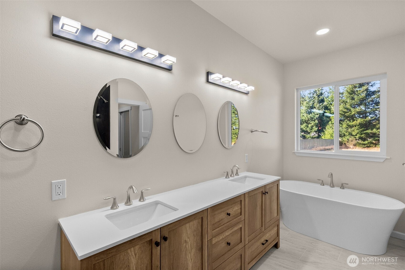 6123 186th Trail Southwest Rochester, WA 98579 - Photo 18 of 35 a bathroom with a double vanity sink and a mirror