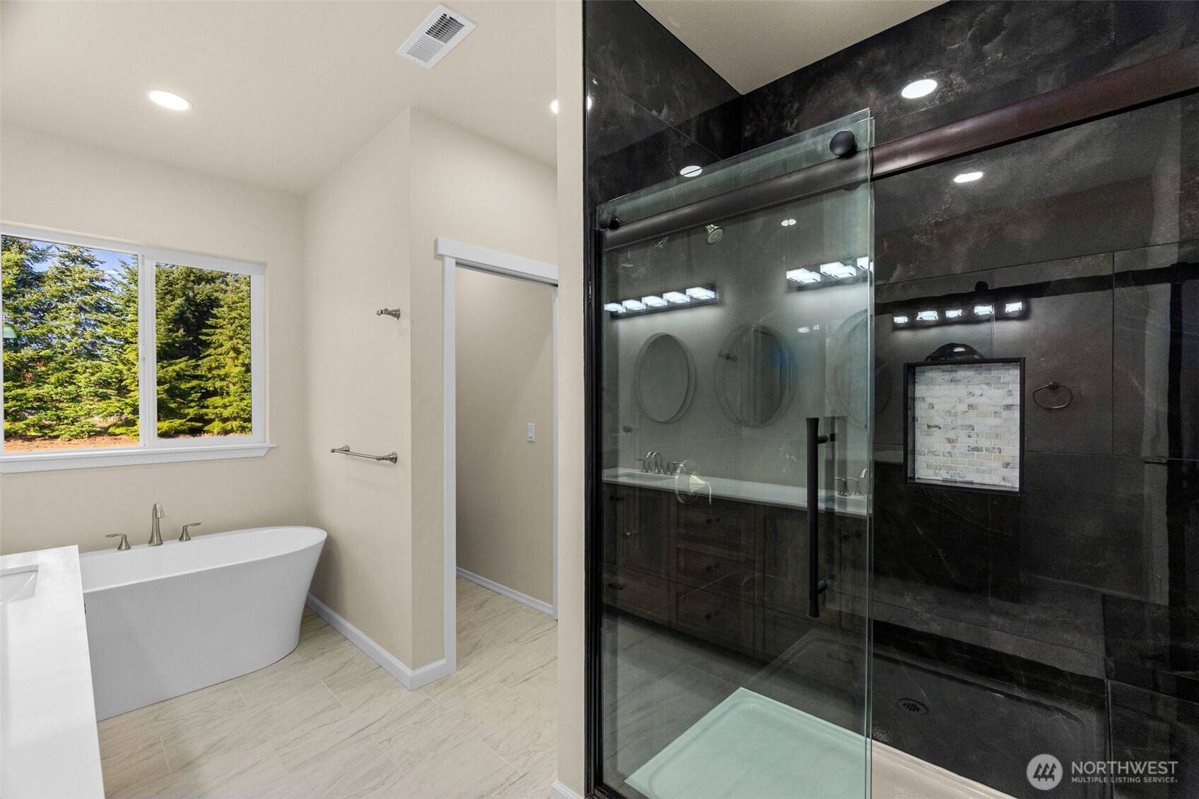 6123 186th Trail Southwest Rochester, WA 98579 - Photo 19 of 35 a bathroom with a bathtub and a shower