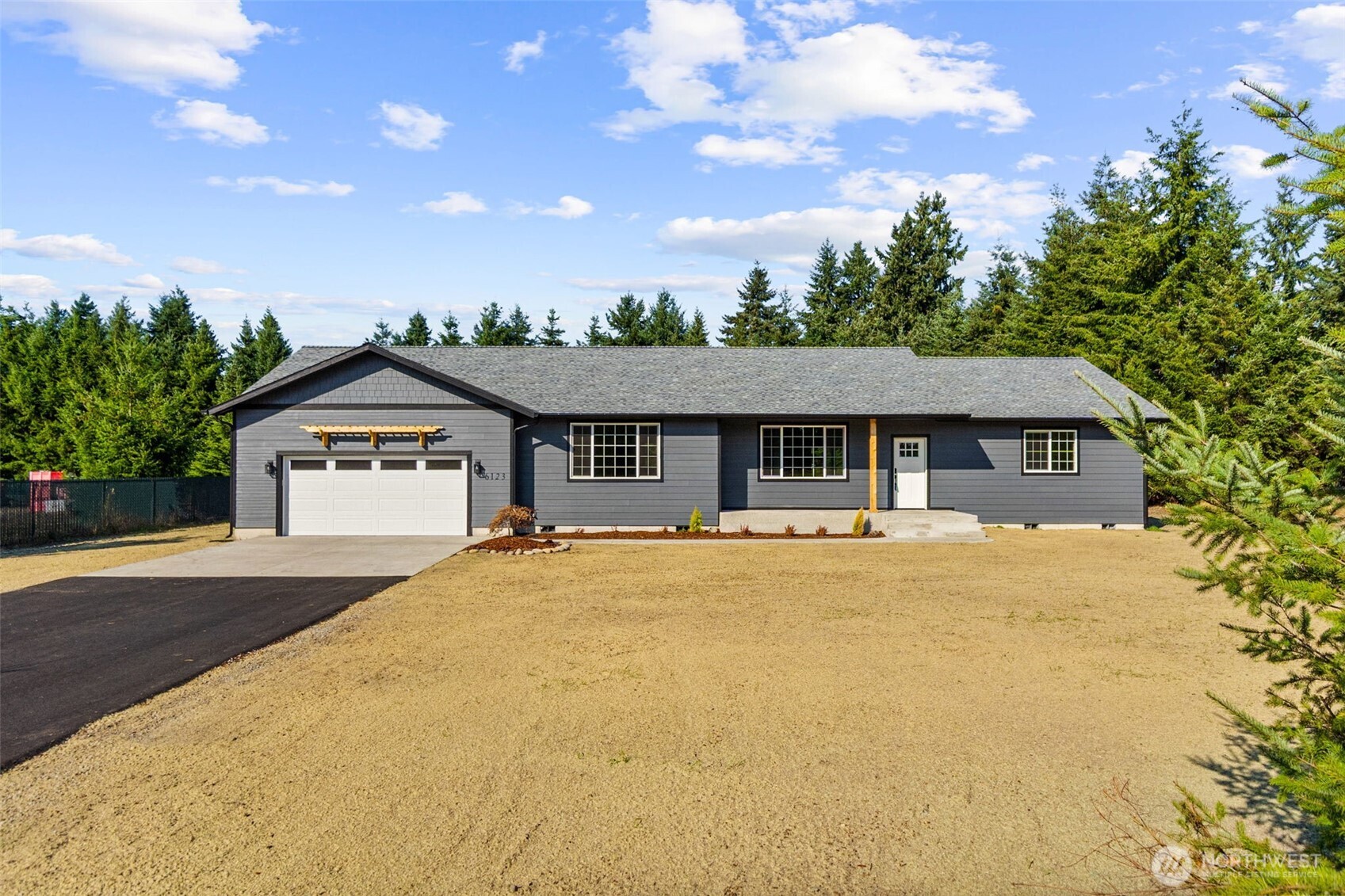 6123 186th Trail Southwest Rochester, WA 98579 - Photo 2 of 35 front view of a house with a yard