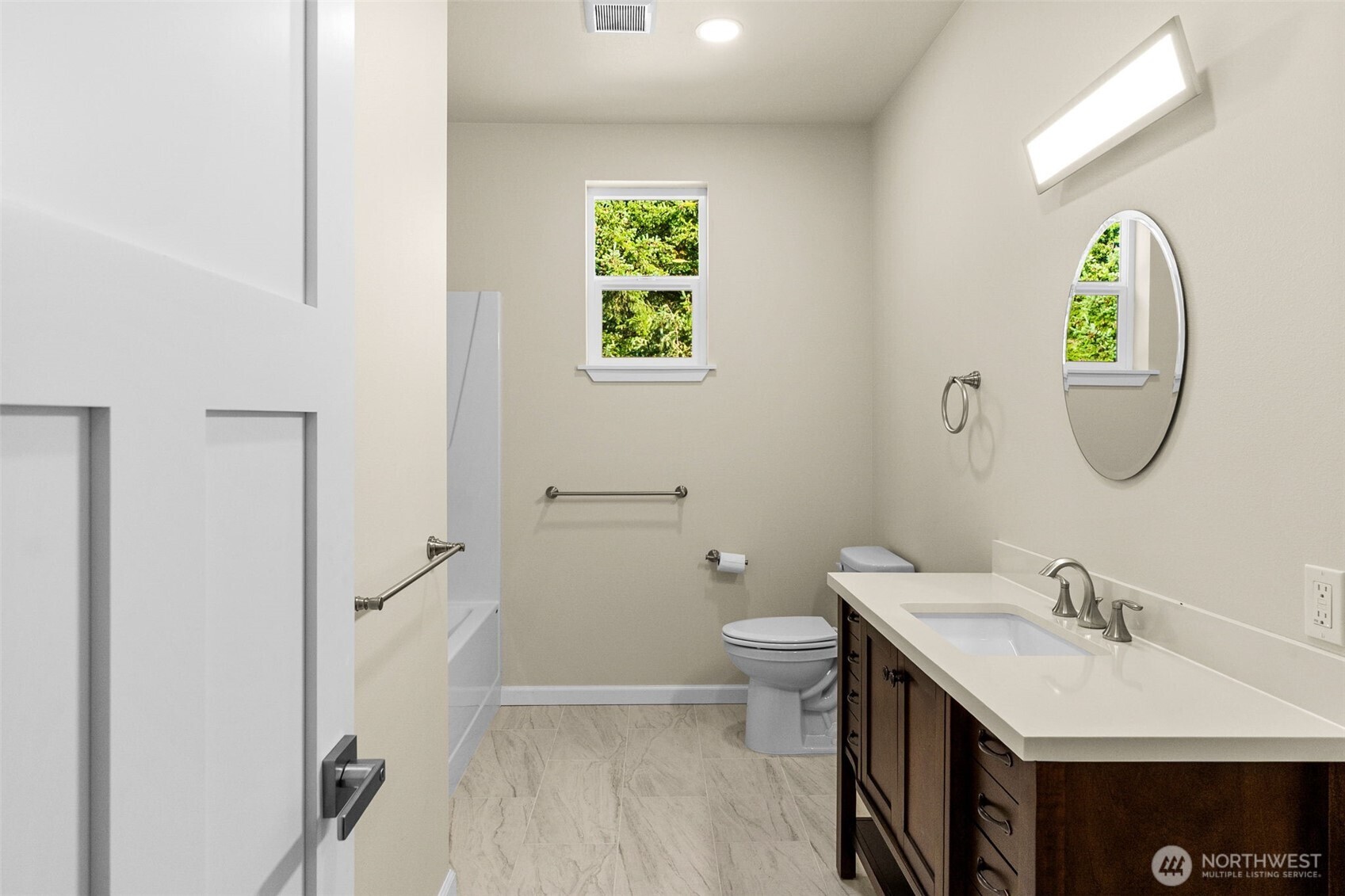 6123 186th Trail Southwest Rochester, WA 98579 - Photo 22 of 35 a bathroom with a sink mirror vanity and toilet