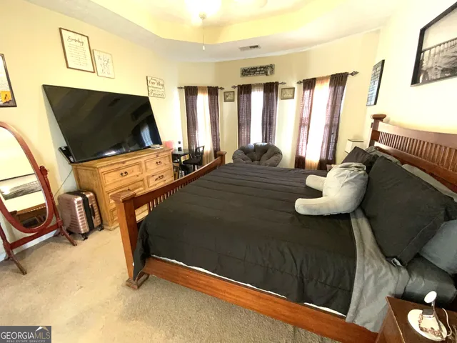 a bedroom with furniture and a window