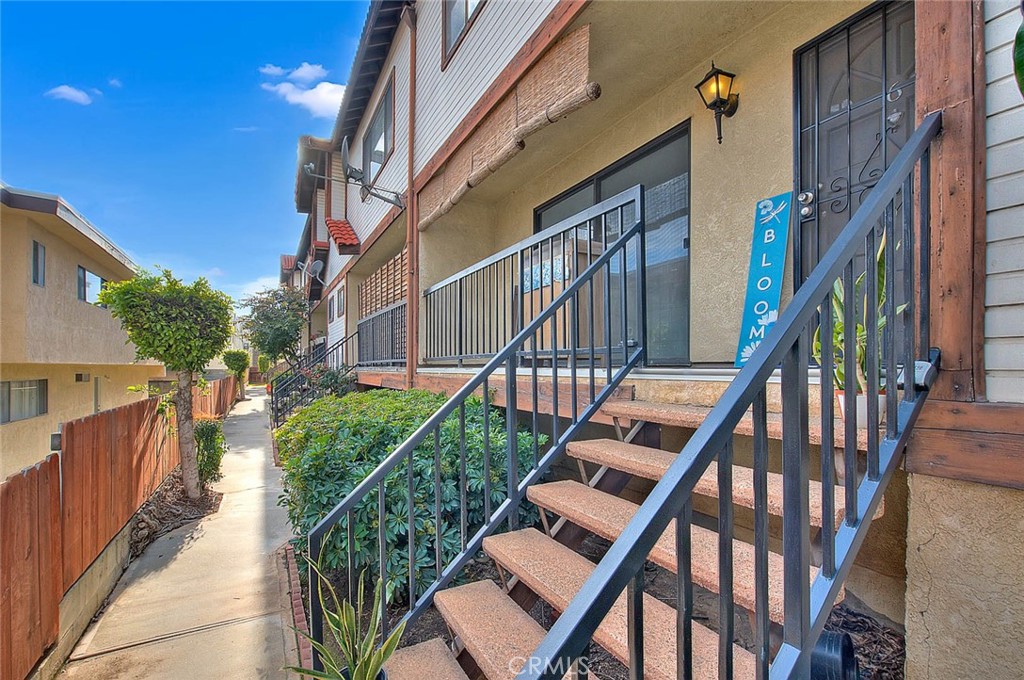 117 North 1st Street, Unit 6 Alhambra, CA 91801 - Photo 2 of 3 a view of staircase with wooden floor and fence