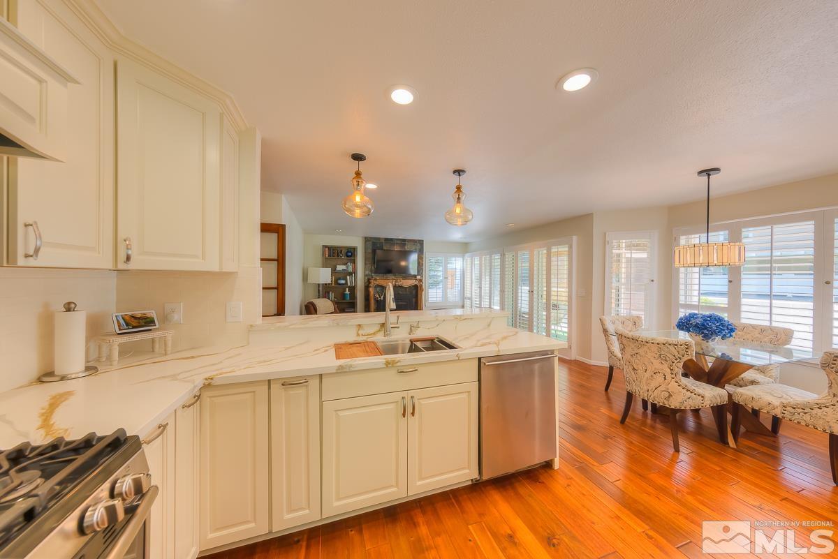 858 Lighthouse Court Reno, NV 89511 - Photo 12 of 39 a kitchen with a sink and cabinets